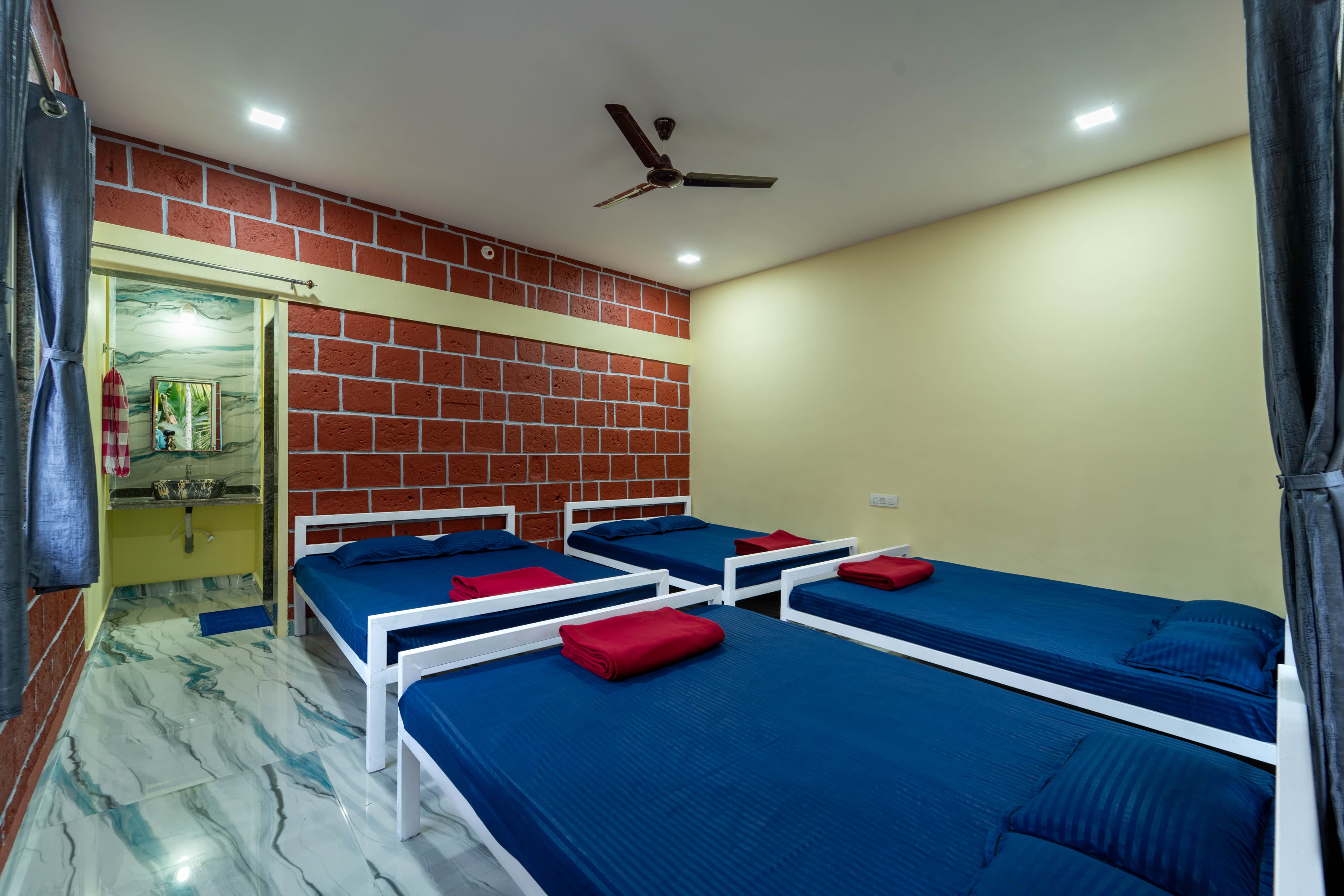 Comfortable group room with multiple beds for families at Infinity Junglestay