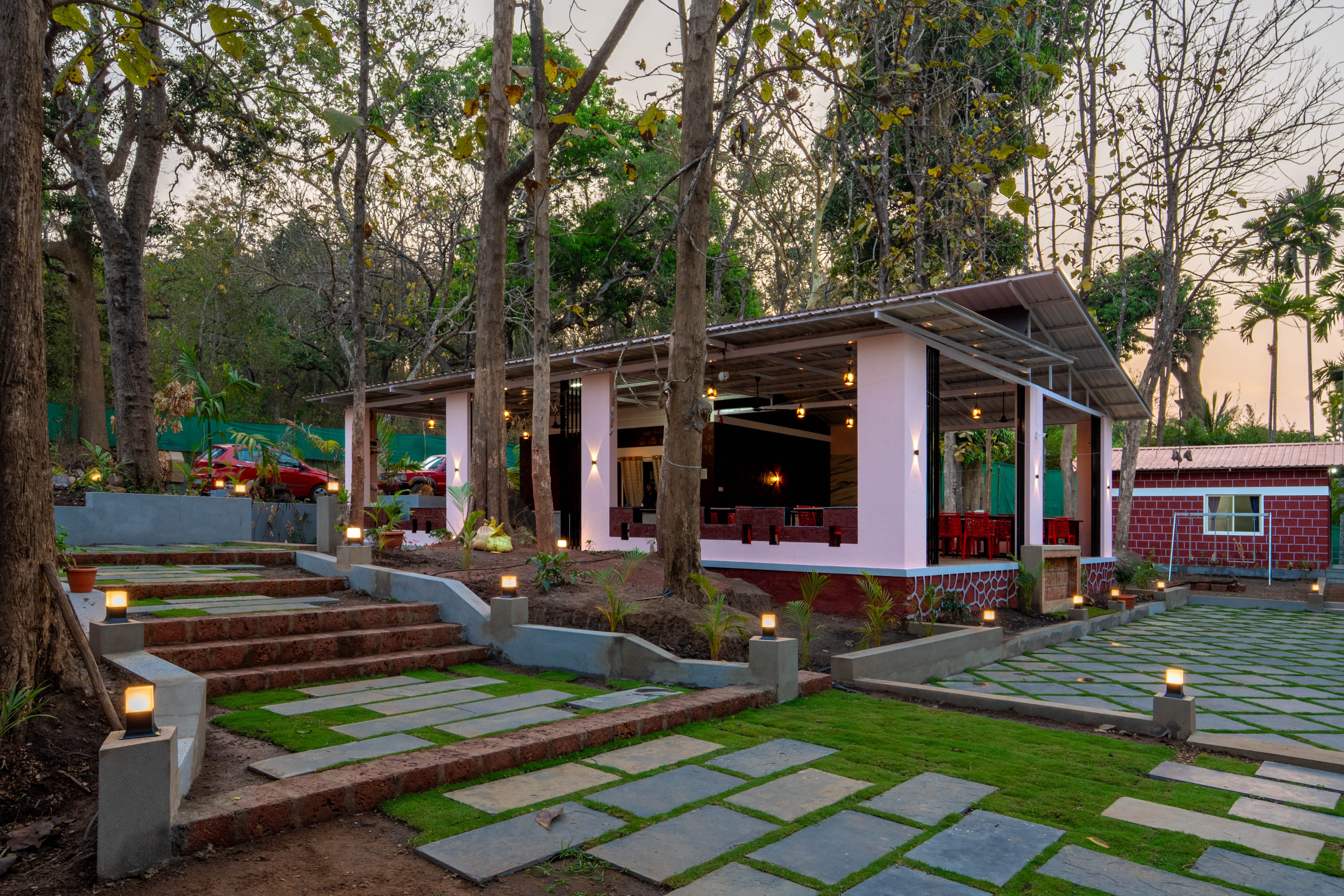 Infinity Junglestay resort building nestled in the lush green forests of Dandeli